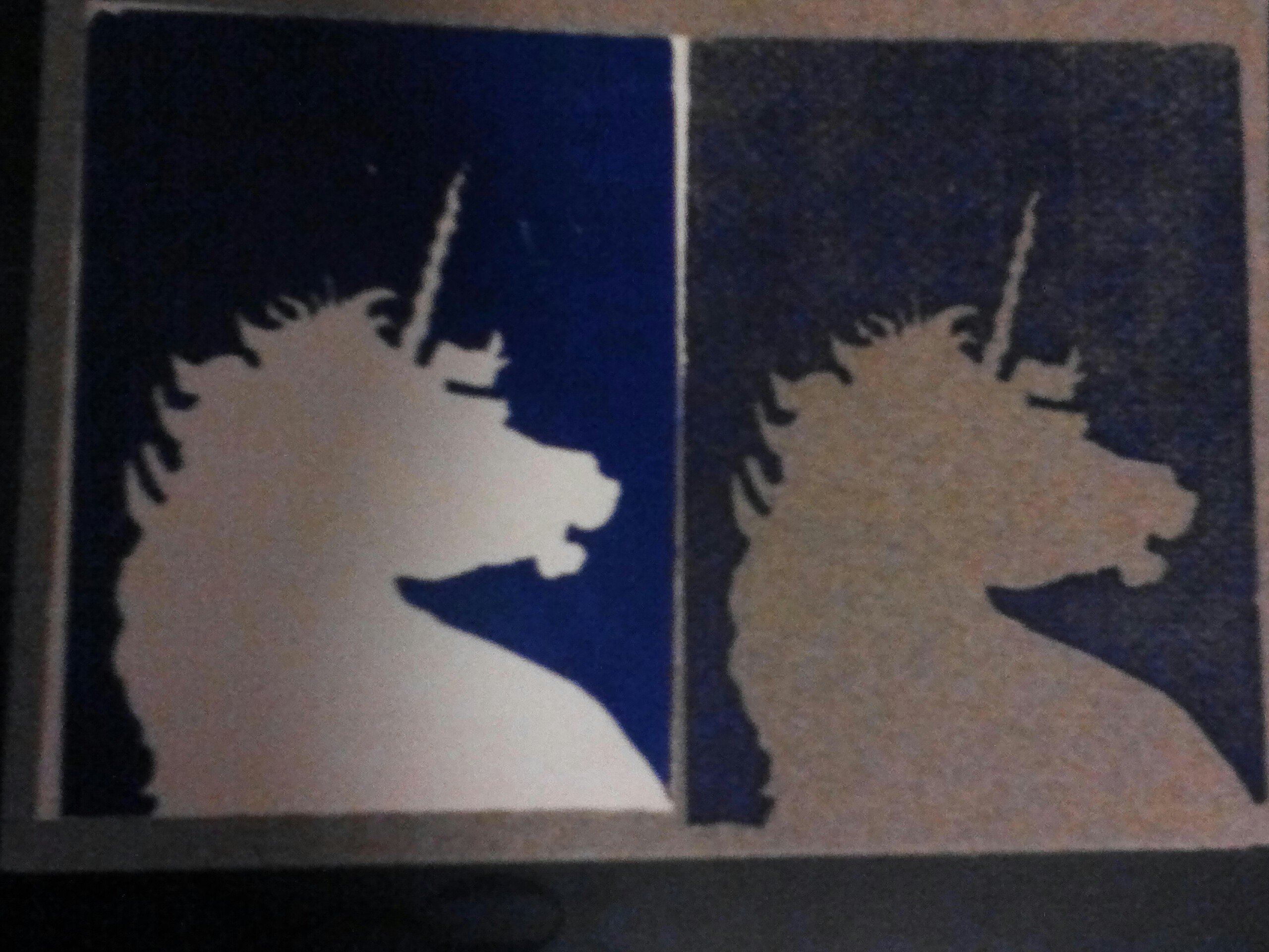 Unicorn head outline, blue ink background surrounding white or grey paper